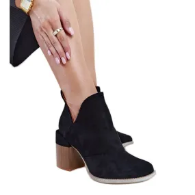 Black asymmetrical insulated ankle boots by Nadica