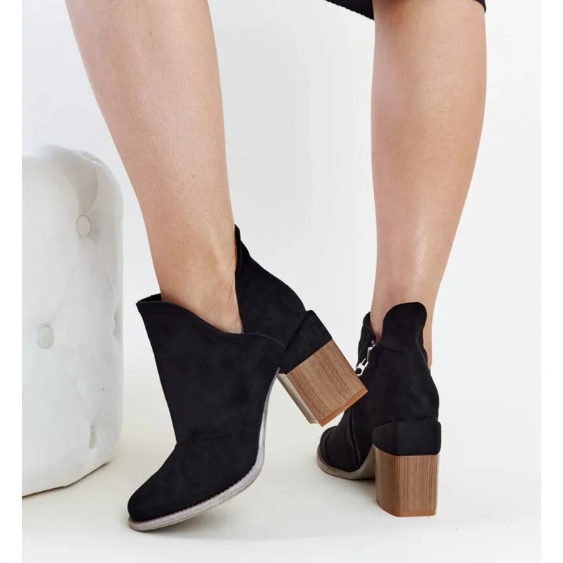 Black asymmetrical insulated ankle boots by Nadica