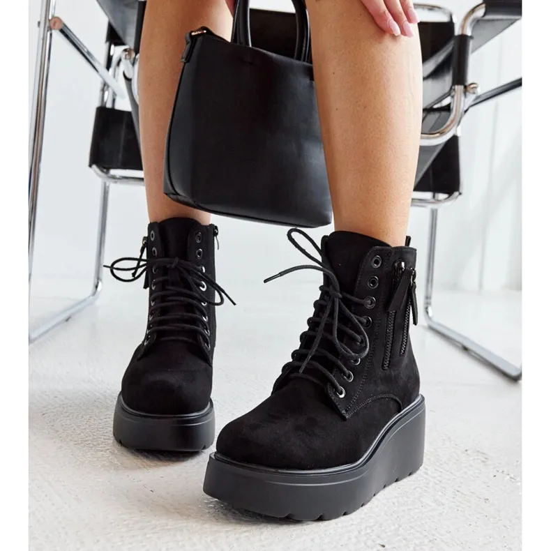 Black insulated suede wedge boots by Safiya