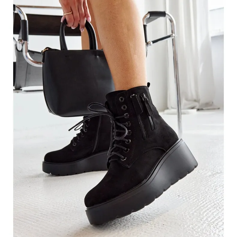 Black insulated suede wedge boots by Safiya