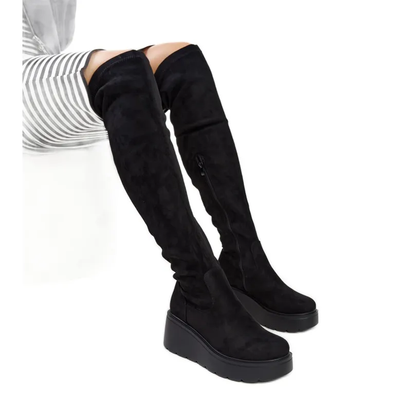 Black long wedge boots by Nafeesa